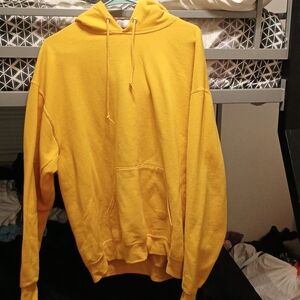 A yellow hoodie with a hood and cozy interior